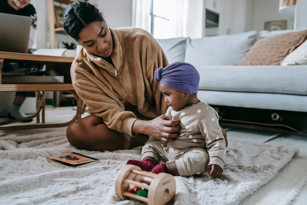 Mother supporting a child at home